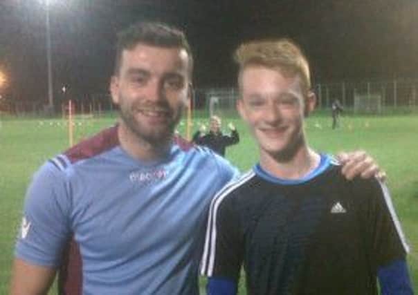 Northend player Bradley Cairns with Crusaders and Northern Ireland player Colin Coates, who took the U15 training last week.