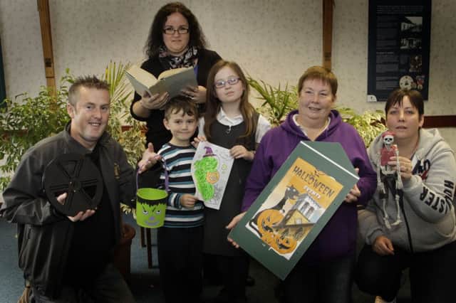 SPOOKY. Scary Stories, Movies and events were announced by Ballymoney Council for Halloween. And pictured promoting the goings on are Martin Neill of Castle Youth Club, Cllr Roma McAfee with Cameron and Rhiannon and Mary and Lizzy Kelly from Carnany Youth Club.INBM42-13 074SC.