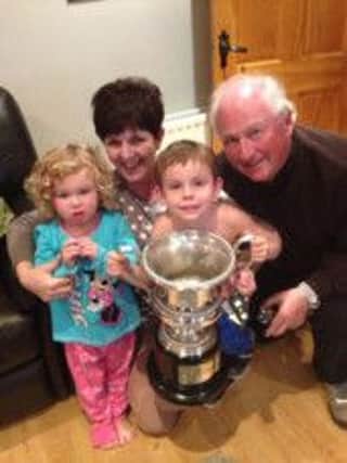 Davy Walls pictured with his family and the Kevin Doherty Memorial trophy which he won last week at Portstewart Golf Club.