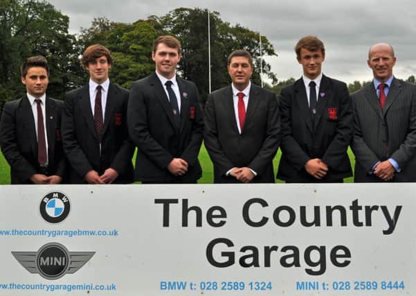 Mr James Walker, of the Country Garage, pictured with his sponsorship board for Ballymena Academy's First XV rugby team. Included are: Eddie Kosch, Jonny McKeown, Duncan Maguire (1st XV Captain), Justin Jolly and Mr Alistair McKay.