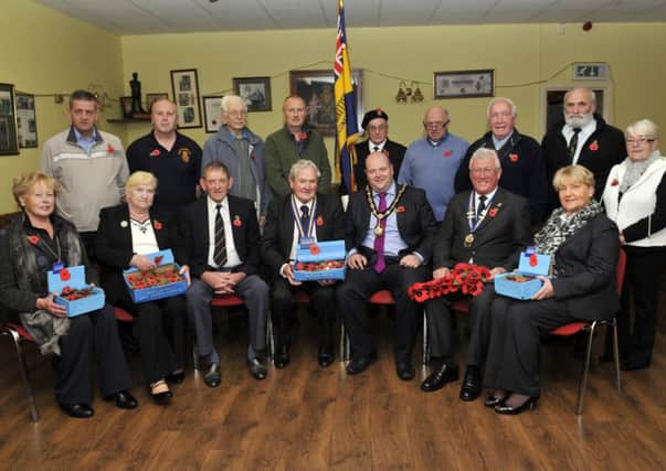 Craigavon Mayor, Cllr Mark Baxter joins Cllr George Savage, branch chairman and members of Donacloney Royal British Legion at the launch of the Annual Poppy Appeal. INLM42-101gc