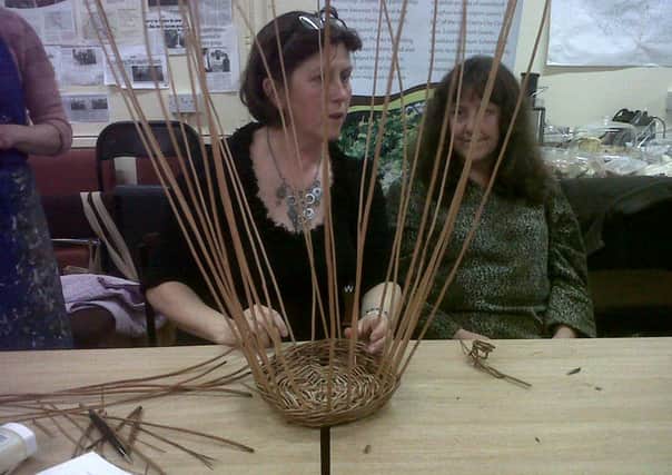 Willowcraft tutor Teresa O'Hare, demonstrating basket weaving at RAPID offices on Foreglen Road.