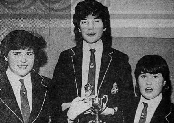 1985 - Alison Mark, Linda Dornan and Jane Carson, prize winners from Clough Girls Brigade display. INBT42-758F