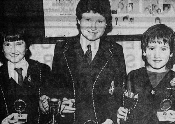 1985 - Linda Mark, Claire Boyd and Karen Boyd with their awards from the Clough Girls Brigade annual display. INBT42-759F