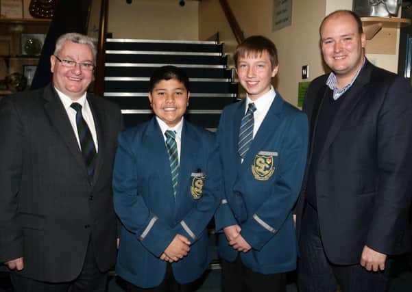 David McIlveen MLA, chair of the All Party Group on Human Trafficing at Stormont, who was the guest speaker at the Slemish College special assembly as part of World Anti Slavery Day. Included are pupils Shakeel Mohammed and Joshua Parke, and principal Dr. Paul McHugh. INBT43-212AC