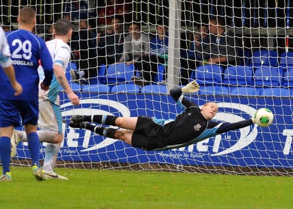 Ballymena United keeper Dwayne Nelson saves Matt Hazley's injury time free kick to earn the Sky Blues a win at Dungannon. Picture: Press Eye.