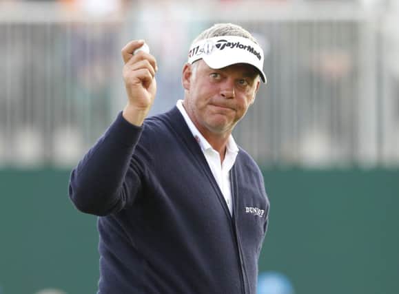 Northern Ireland's Darren Clarke acknowledges the crowd on the 18th during day two of the 2012 Open Championship at Royal Lytham & St. Annes Golf Club, Lytham & St Annes. PRESS ASSOCIATION Photo. Picture date: Friday July 20, 2012. See PA story GOLF Open. Photo credit should read: Peter Byrne/PA Wire. RESTRICTIONS: Use subject to restrictions. Editorial use only. No commercial use. Call +44 (0)1158 447447 for further information.