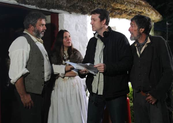 Chatting through the script for Stumpys Brae during a break in filming for the Ulster Scots horror drama, are from left, Nigel ONeill (John), Louise Matthews (Sarah), Darren Gibson from Eglinton who scripted the story for television and Lalor Roddy (The Pedlar).
