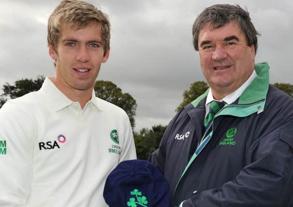 Graeme McCarter receives his first Ireland Cap from Team Manager, Roy Torrens in 2011.