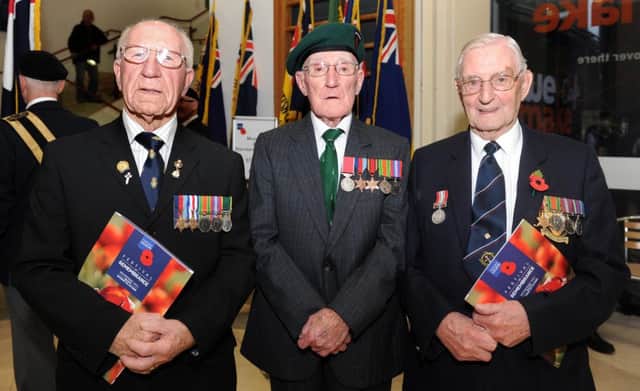 Pictured at the Royal British Legion Festival of Remembrance, which took place at the Waterfront Hall on October 19, are (l-r) World War II veterans Thomas Asher, Bob Wright and Charles McIntyre. Pic by Declan Roughan, Presseye