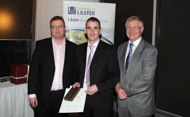 Pictured at the Ulster Business Awards ceremony are award winner David Walker (centre) with award sponsor Michael Christie (left), Ernst & Young and UBS course director Gregory McGrath. INNT 43-457-CON