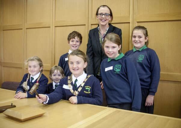 Pupils from St.Marys PS, Rathlin and Dunseverick PS get a taste of how local goverment operates at a recent Moyle Council Open Day. Included is Chair of Moyle Cara McShane.INBM43-13 200JC
