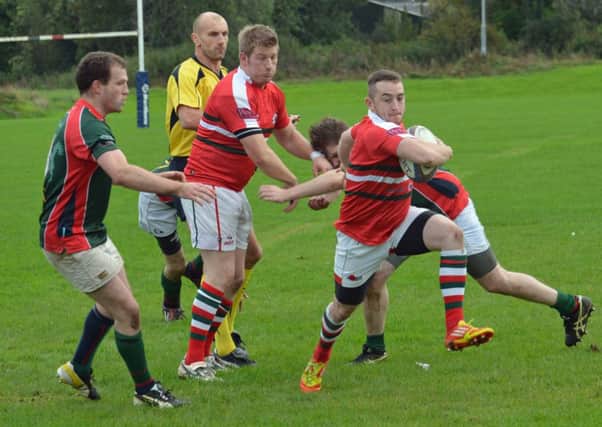 Larne scrum-half Richard McIlheron breaks through the Civil Service defence to score his side's first try in their Gordon West Cup clash. INLT 43-018-PSB