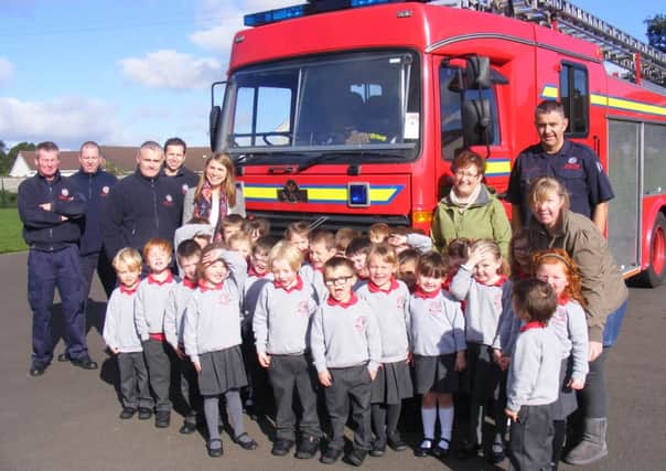 Ballymena Fire Service came to visit the pupils in Primary 1/2 at Carniny Primary School. The firemen told the children about their job, let them see in the fire engine and let them use the hose. The pupils thoroughly enjoyed the experience as part of their studies of People Who Help Us. Also included in the picture is Mrs K Scott, Mrs R Fletcher and Miss Minford.