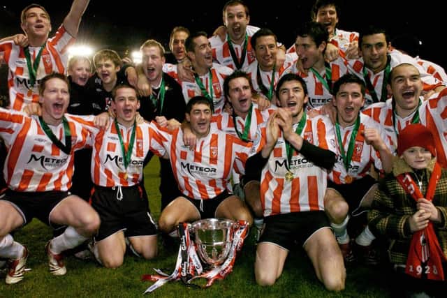 Derry City players celebrate at the end of the 2006 FAI Cup Final.