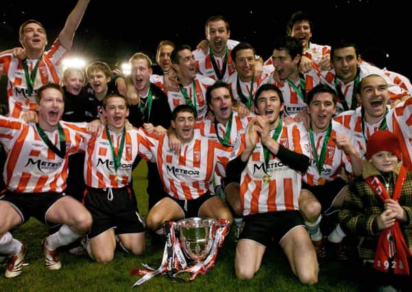 Derry City players celebrate at the end of the 2006 FAI Cup Final.