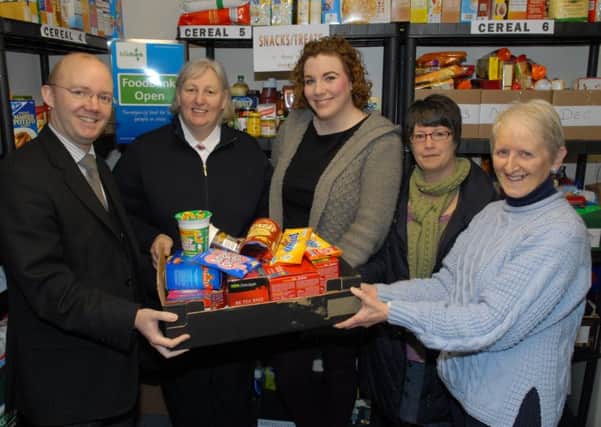 Grant Robinson from Mulhollands; Sue Whitla from the Salvation Army; Ruth Kelly from St MacNissi's and StAnthony's churches; Lana McCann; and Kay Aiken pictured at the launch of the Larne Foodbank in Craigyhill Methodist Church Hall in March. INLT 13-355-PR