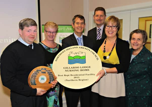 Jim Baxter, nurse manager Nicki McCrudden and director Liz Rowan, all from Gillaroo Lodge, celebrate the home's success with Health Minister  Edwin Poots, Paul Cummings of the Northern Health and Social Care Trust and Doreen Muskett MBE, chairman, NIAC. INLT 44-604-CON