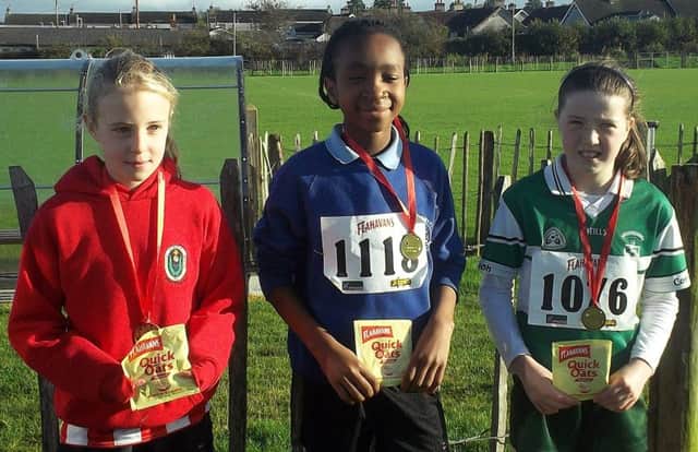 Lucy McCallum (DH Christie Memorial PS) third, Tolulope Jide-Ojo (Portstewart PS) first and  Niamh McKay (Glenravel PS) second.