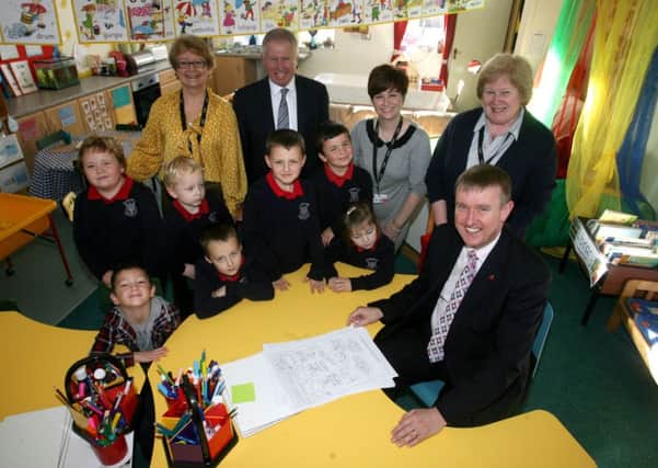 Mervyn Storey MLA, who officially opened the new Nurture Den at Harryville PS, is pictured with pupils, staff Mrs. V. Hall, Mrs. L. Sands and Mrs. L. Meikle (Principal) and chairman of the Board of Governors Mr. Denis Harvey. INBT44-218AC