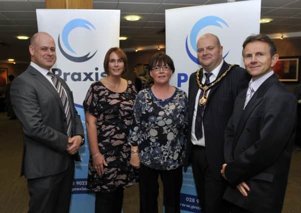 Craigavon Mayor, Cllr Mark Baxter at the Praxis Care, 21st Anniversary event in Craigavon Civic Centre with, Stanley McGoldrick, Lurgan project manager, Karen Harding, acting manager, Mary Clarke, assistant director and Joe O'Neill, Portadown project manager. INLM40-115gc