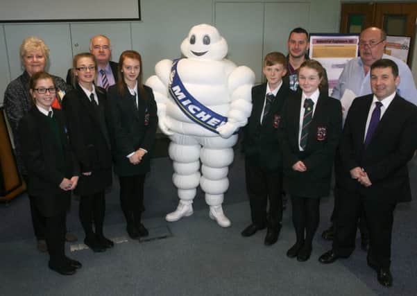 Pupils from St. Patrick's College and Cambridge House School, pictured along with Cllr. Monica Digney, Cllr. Martin Clarke, Cllr. Timothy Gaston, Robin Swann MLA and Jim Briggs (Workforce Development Manager) at a Michelin Career in Manufacturing Day. INBT44-207AC