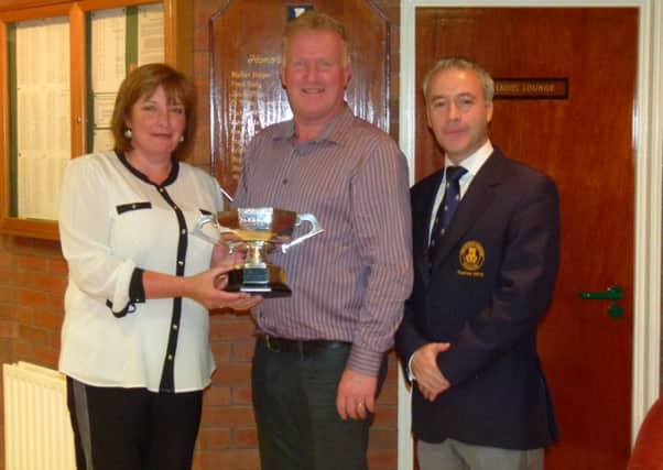 Cheryl and John Chambers, winners of the annual City of Derry Open Mixed Foursomes Match play Championship, pictured with Prehen Captain, Mr Michael McCullough.