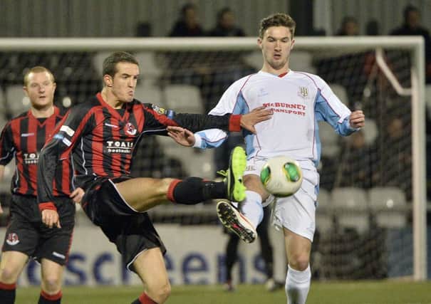 Ballymena United striker Michael McLellan challenges for possession with Crusaders' Josh Robinson during the County Antrim Shield semi-final at Seaview. Picture: Press Eye.