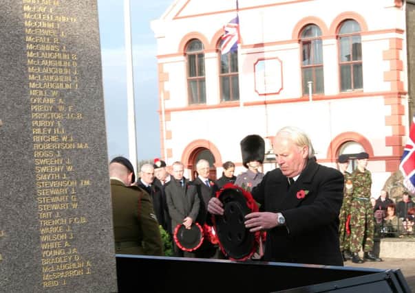 The Lord Lieutenants deputy Harry Boyle lays the first wreath on behalf of the Queen, at the War Memorial Service  of Remembrance in Limavady on Sunday.  INLV4611-628KDR