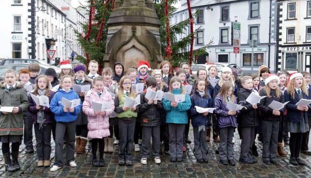 Gaelscoil an Chaistil Choir singing Christmas Carols at the Diamond in Ballycastle.INBM52-11 295JC