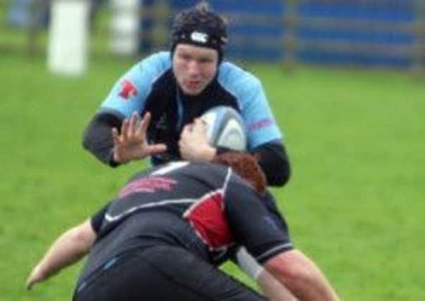 SHOVE OFF. A Ballymoney Firsts player shoves aside his Ballymena opponent.INBM44-13 047SC.