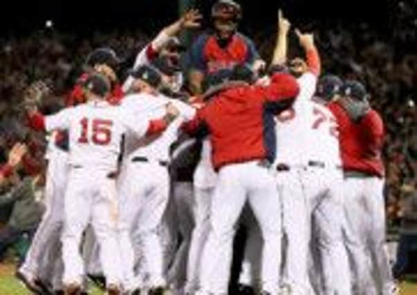 The Boston Red Sox celebrate their win over St Louis Cardinals to claim the World Series title.