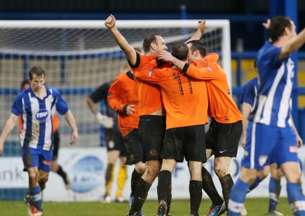 Glenavon players celebrate after Ciaran Martyn's second goal put them 2-1 ahead at Coleraine.