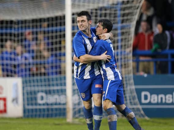 Coleraine's Eoin Bradley is congratulated by team-mate Gareth Tommons after scoring the Coleraine equaliser. Picture by John McIlwaine/Presseye.com