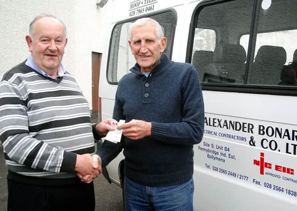 Alan Mark, of Ballymena Road Club,  receives a sponsorship cheque from Alec McAuley of Alexander Bonar and Co. LTD. INBT 40-821H