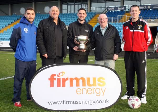 Stephen Milligan (Carniny Rangers) and Gary Bonnes (Harryville Homers) are pictured with league officials Davy King and Brian Montgomery are pictured with David Fusco of Firmus, promoting the Firmus Energy Top Four Final to be played between the two team on November 8. INBT45-250AC