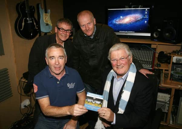 Jackie Fullerton is pictured along with Paul McNeilly (producer), Davy Sloan (singer) and Colin Agnew (writer) with their Ballymena United CD. INBT45-264AC