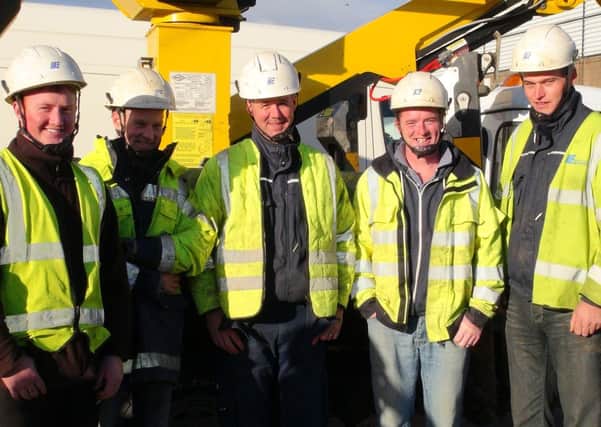 NIE linesmen Stuart Curran, Gary Cairns, Tommy Gribben, Colin Reid, Paul Patton normally based in the Craigavon and Downpatrick areas travelled to Kent to help in the wake of the St Jude storm.
