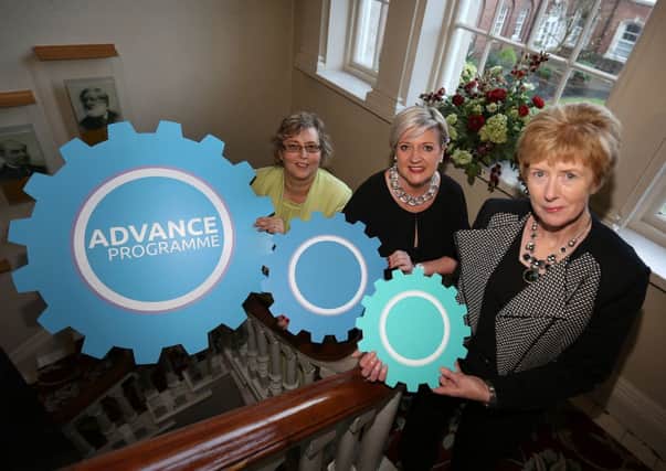 Interlocking the cogs of enterprise, employment and education: Sandara Kelso-Robb (centre) executive director of Lloyds TSB Foundation for NI and advance programme managers Audrey Murray (left) and Anne Walsh launch a unique new project which will provide employment for 40 Neets (young people not in employment, education or training). INLT 45-651-CON