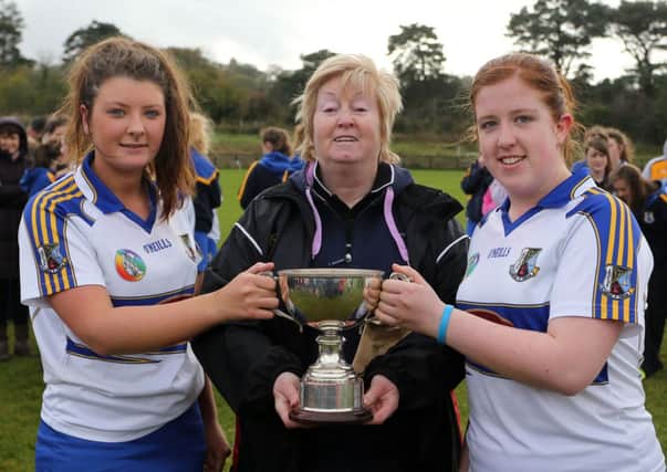 The Senior B Cup is presented to St Killian's players Sinead Cosgrove (left) and Oonagh Ward after their team's win over St Pius in Saturday's final in Ballymena. Pic by John McIlwaine. INLT 45-822-JM