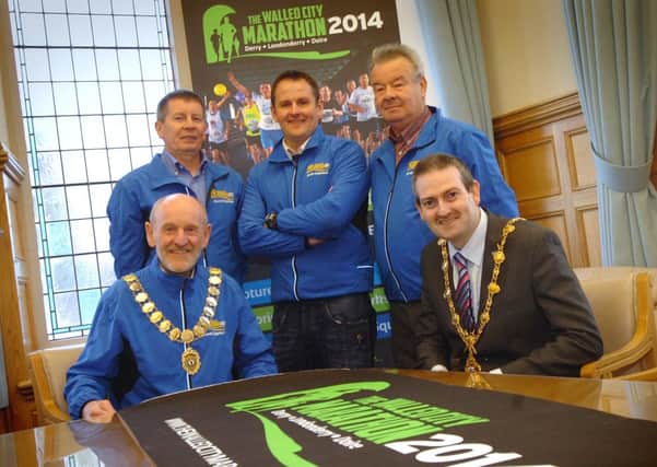 The Mayor of Derry Colr. Martin Reilly launches the 2014 Walled City Marathon with, from left, Gerry Lynch, Athletics NI president, and marathon officials Noel McMonagle, Scott Galbraith and Charlie Large.
