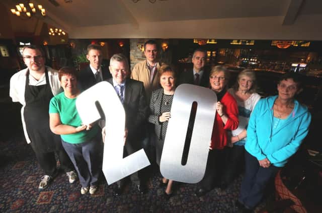 Eugene and Catherine McKeever, owners of Corr's Corner Hotel for the past 20 years, celebrate the milestone with staff members Deirdre Donnelly (accounts), Karen Agnew (conference manager), Molly Cully and Jean Leitch (both kitchen staff), Gary Kiely (sous chef), Martin Toner (general manager), Jason Gault (head chef) and Dermot Corbett (deputy general manager).