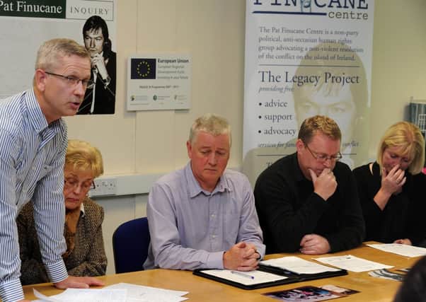 Danny Toland(left)whose father John was murdered in 1976 at Eglinton speaking at press conference-listening is his mother Marie(wife of murdered John) Paul O'Connor (centre)of the Pat Finucane Centre. Right are brother and sister John Loughrey and Pauline McLaughlin,who are children of murdered Jim Toland,shot dead in 1976.