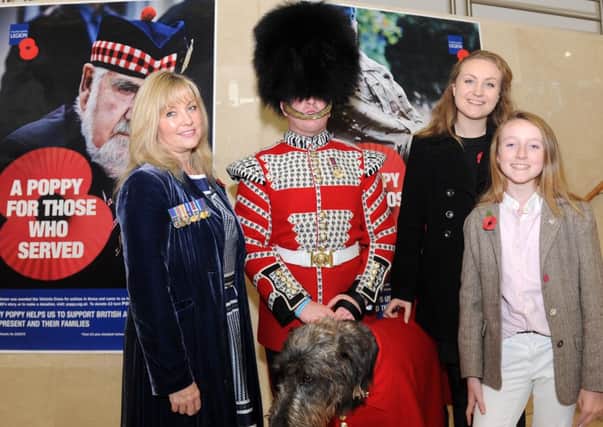 Pictured at the Royal British Legion Festival of Remembrance at the Waterfront Hall on 19th October 2013 are Brenda, Alexandra and Victoria Hale with Drummer Steed and the Royal Irish Regimental Mascot, Domhnall (Irish Wolfhound).   Copyright Presseye / Declan Roughan