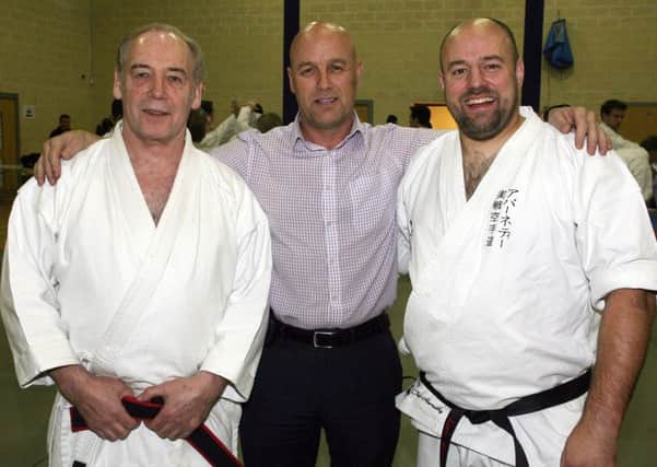 Dan Redmond, chief instructor of the Chujo Karate Association, is pictured along with special guest Iain Abernethy who gave a demonstration to club members at Ballymena North Centre. Included is Jim McCandless (Ballymena North). INBT45-267AC