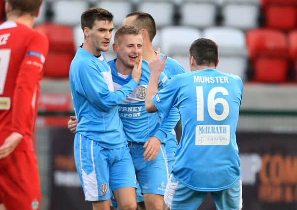 David Cushley (centre) celebrates with his Ballymena United team-mates after scoring in Saturday's match at Cliftonville. Picture: Press Eye.