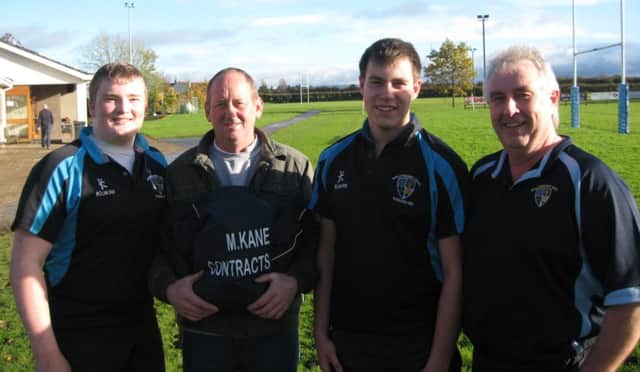 Michael Kane , M.Kane Contracts, Youth Rugby Sponsor, presenting subs warm weather coats to Capt Ben Graham , Vice Capt Matthew Johnston and Youth Rugby Chairman Alan Campbell.