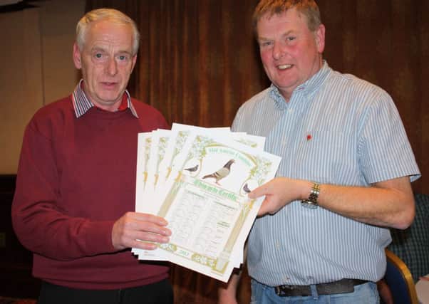 Davy Campbell (r) presents the Mid Antrim Combine Diplomas to Jeff Surgenor.