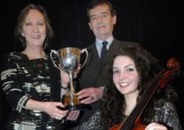 Eva Richards Winner of the Beggs and Partners Instrumental Award is pictured with the 2013 Adjudicator Helen Deakin and Mr Beggs ( Sponsor ).  Since winning the Award, Eva won the 3013 Northern Ireland Musician of the Year, spent two weeks in Minnesota, USA at an International Cello course and most recently gained a place in the 2014 National Youth Orchestra of Great Britain