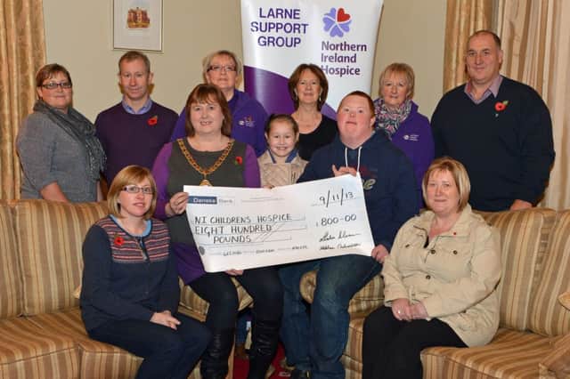 Mayor of Larne,Maureen Morrow and Steve Robinson Junior present a cheque for £800 on behalf of the Robinson and Morrow families to Roma Brown,Davina Adair and Pamela McAuley of the Larne Support Group for the NI Hospice,the money was raised through a vintage tractor run organised by Stephen Robinson and Leslie Morrow. INLT 46-017-PSB